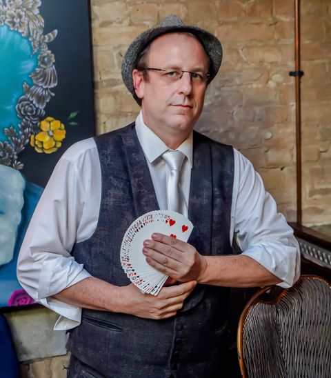 Eric Kurit, Palm Beach magician, fanning a deck of cards